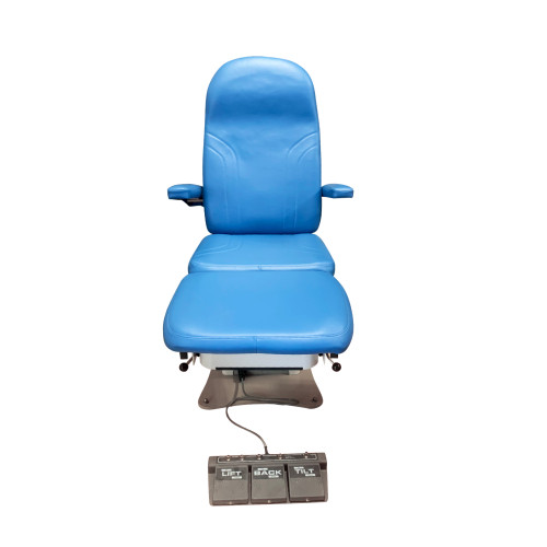 Front view of a blue MTI 527 Tri-Power podiatry chair with padded armrests and a connected foot pedal labeled.