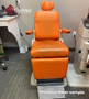 Reliance 6200H ENT exam chair refurbished with orange upholstery in a medical room.