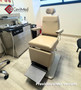 Reliance 6200H ENT exam chair refurbished with mushroom upholstery next to an ENT cabinet in a medical room.