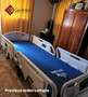 Refurbished Hill-Rom TotalCare P1840 in a bedroom with a blue mattress.