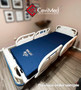 Refurbished Stryker S3 3002 in a bedroom with a blue mattress.