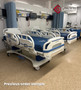 Several refurbished Stryker S3 in a clinic room with blue mattresses.