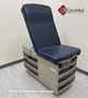 Midmark Ritter 304 with navy upholstery, and drawers in a medical room.