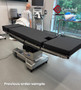 Refurbished Amsco 3085 SP Surgical Table in clinical setting, featuring black cushions, stainless steel base in a medical room.