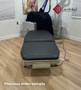 Midmark Ritter 244 refurbished with black upholstery in a clinic room.