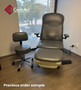 Gray Midmark 647 refurbished with matching stool in front of a window in a clinical room.