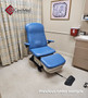 Refurbished Midmark 647 with pacific blue upholstery, and a foot control in a clinic room.