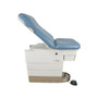 Midmark Ritter 223 exam table with blue upholstery, shown in side view with raised backrest.