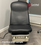 Black Midmark 622 barrier-free refurbished in a clinical room.