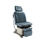 Midmark Ritter 230 Universal Power Procedures Table in upright position with blue-green upholstery, showcasing powered base, adjustable headrest, and leg rest.