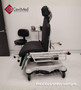 Refurbished Stryker 5051 in a clinic room with a black mattress.