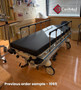 Refurbished Stryker 1069 in a clinic room with a black mattress.