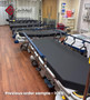 Several refurbished Stryker 1069 in a clinic room with black mattress.