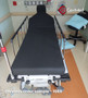 Refurbished Stryker 1089 in a clinic room with a black mattress.