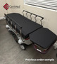 Refurbished Stryker 1061 in a clinic room with a black mattress.