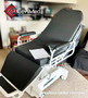 Refurbished TransMotion Medical TMM4 in a clinic room with a black mattress.