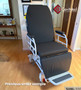 Refurbished TransMotion Medical TMM4 in the lobby of a clinic with a black mattress.