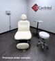 White Midmark 630 procedure barrier-free refurbished with matching stool in a modern clinic.