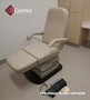 Refurbished Midmark 417 with mushroom upholstery, and a foot control in a clinic room.