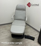Refurbished Midmark 417 with pearl gray upholstery, and a foot control in a clinic room.