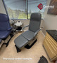 Refurbished Midmark 417 with cruiser gray upholstery, and a foot control in a clinic room.
