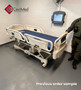 Refurbished Stryker FL28C in a clinic room with a blue mattress.