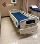 Refurbished Stryker FL28C in a clinic room with a blue mattress.