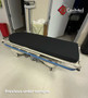 Hill-Rom P8000 refurbished in a medical room with black mattress.