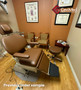Brown Midmark Ritter 391 ENT chair in exam room with framed posters and guest chairs.