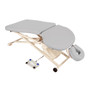 Light gray Oakworks PT400M Physical Therapy Table with ergonomic cutouts, adjustable face cradle, and foot pedal control on a white metal scissor-lift base with wheels.