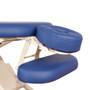 Close-up of adjustable blue cushioned face cradle and armrest on an Oakworks PT400M Physical Therapy Table with white frame.