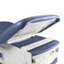 Close-up of a Midmark Ritter 204 manual exam table with raised backrest, showing hidden storage compartment and light blue upholstered cushioning.