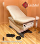 Midmark 626 exam chair with pearl upholstery and foot control in a modern clinic.