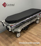 Refurbished Stryker 1001 in a clinic room with a black mattress.