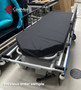 Refurbished Stryker 1211 in a medical room with a black mattress.