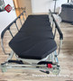 Refurbished Stryker 1731 in a clinic hallway with a black mattress.