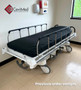 Refurbished Stryker 721 in a medical room with a black mattress.