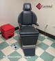 Jedmed N exam chair refurbished with black upholstery, and foot control in a medical room.