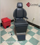 Jedmed N exam chair refurbished with black upholstery, and foot control in a medical room.