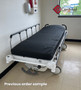 Refurbished Stryker 1004 in a clinic room with a black mattress.