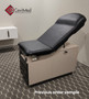 Midmark 104 round top exam table with black upholstery.