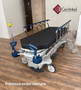 Refurbished Stryker 1007 in a clinic room with a black mattress.