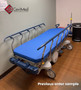 Refurbished Stryker 1007 in a clinic room with a blue mattress.