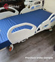 Refurbished Hill Rom Advanta 2 in a bedroom with a blue mattress.