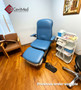 Refurbished Midmark 647 with pacific blue upholstery, and a foot control in a clinic room.