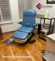 Refurbished Midmark 647 with classic blue upholstery, and a foot control in a clinic room.
