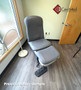 Refurbished Midmark 647 with cruiser gray upholstery, and a foot control in a clinic room.