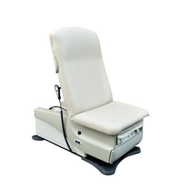 Midmark 625 bariatric treatment table with light gray upholstery, shown isolated on a white background, featuring a power-adjustable backrest and footrest, and a side-mounted hand control.