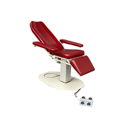Red UMF 8678 power phlebotomy chair with reclining backrest, padded armrests, and foot section, mounted on a pedestal base with attached foot control panel.