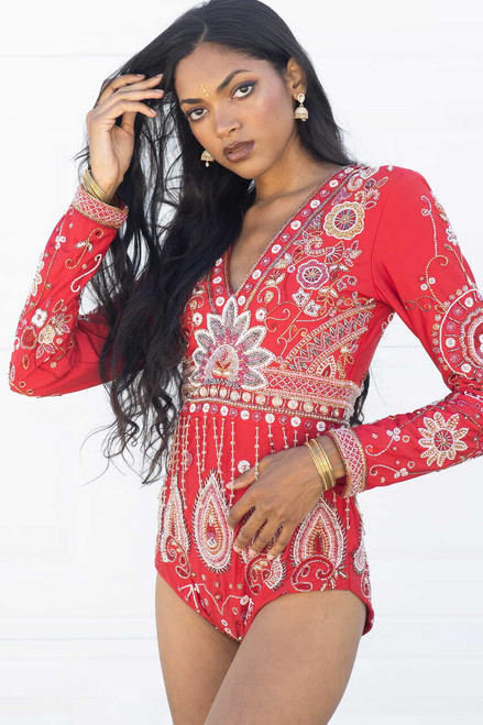 Model wearing the Amara crimson and gold hand-embellished long sleeve bodysuit